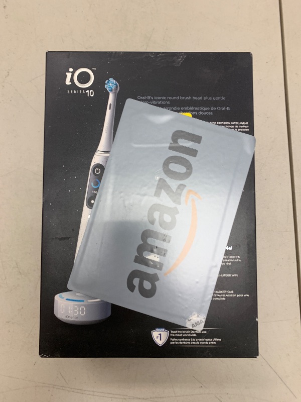 Photo 1 of Oral-B iO Series 10 Rechargeable Electric Toothbrush with Visible Pressure Sensor to Protect Gums, 2 Min Timer, 7 Cleaning Settings, 4 Replacement Toothbrush Heads, and Charging Travel Case, White