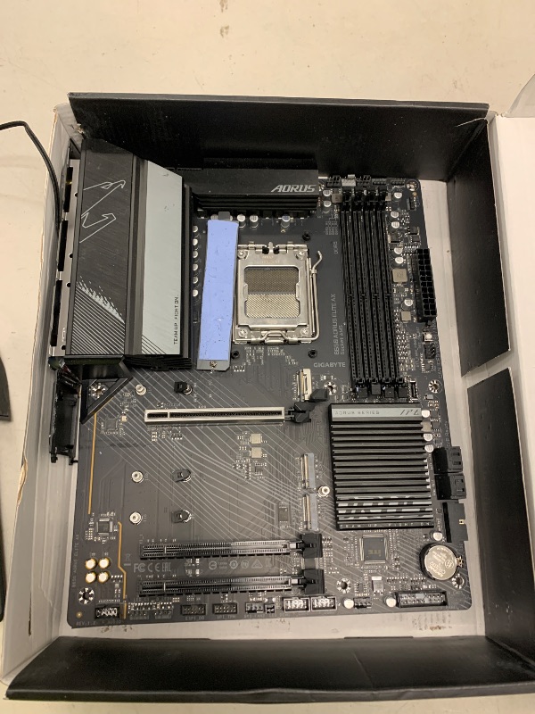 Photo 1 of FOR PARTS ONLY GIGABYTE B650 AORUS Elite AX (AM5/LGA 1718/ AMD B650/ATX/ 5-Year Warranty/DDR5/ M.2/ PCIe 5.0/USB 3.2 Gen2X2 Type-C/WiFi 6E/2.5GbE LAN/Q-Flash Plus/EZ-Latch/Gaming Motherboard)