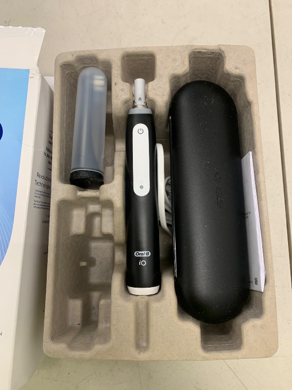 Photo 1 of Oral-B iO Deep Clean Rechargeable Electric Powered Toothbrush, Black with iO Series 3 Limited, 2 Brush Heads and Travel Case - Pressure Sensor to Protect Gums - 3 Cleaning Settings - 2 Minute Timer