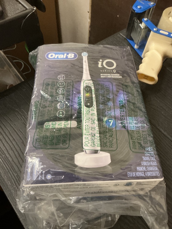 Photo 1 of Oral-B iO Series 9 Electric Toothbrush with 3 Replacement Brush Heads, White Alabaster