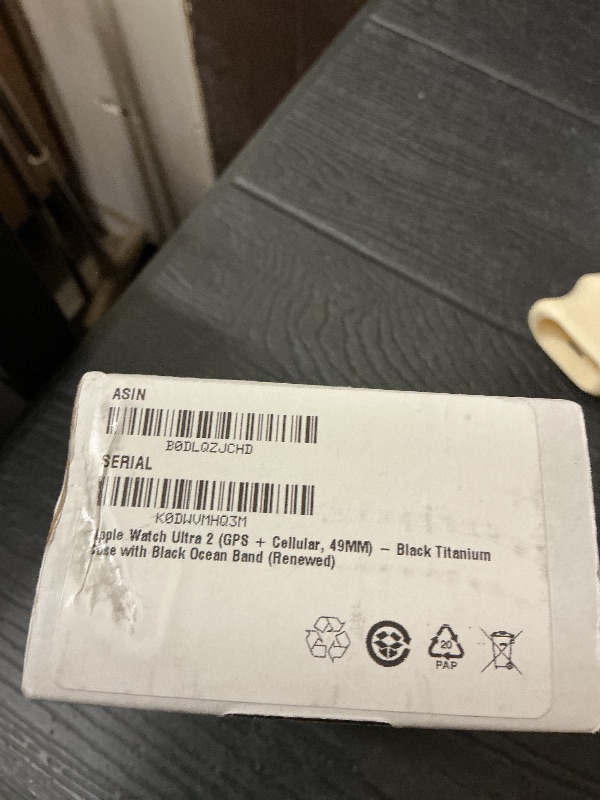 Photo 1 of Apple Watch Ultra 2 (GPS + Cellular, 49MM) - Black Titanium Case with Black Ocean Band (Renewed)