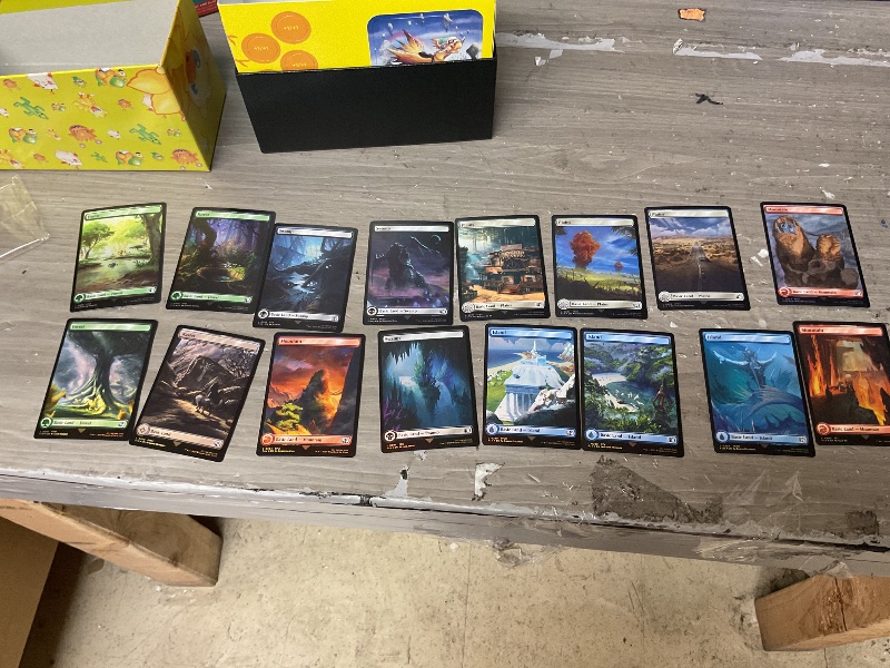 Photo 1 of Magic: The Gathering - Final Fantasy Chocobo Bundle (1 Chocobo Booster, 10 Play Boosters, 1 Alt-Art Promo Card, 1 Scene Card, 32 Basic Lands, 1 Click Wheel, and More)