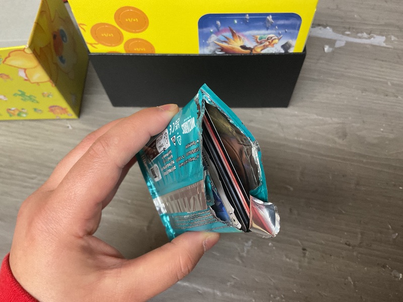 Photo 1 of Magic: The Gathering - Final Fantasy Chocobo Bundle (1 Chocobo Booster, 10 Play Boosters, 1 Alt-Art Promo Card, 1 Scene Card, 32 Basic Lands, 1 Click Wheel, and More)