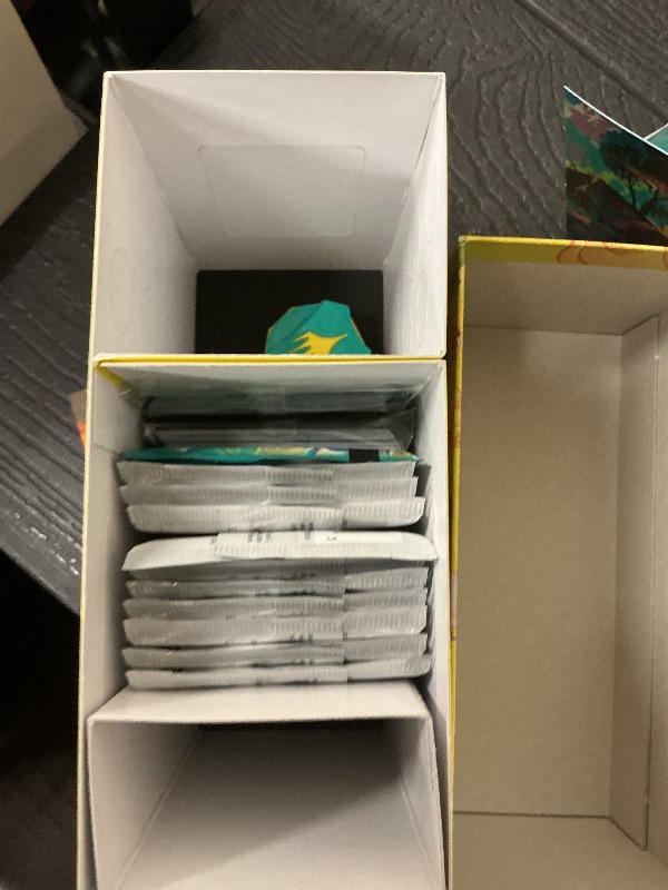 Photo 1 of Magic: The Gathering - Final Fantasy Chocobo Bundle (1 Chocobo Booster, 10 Play Boosters, 1 Alt-Art Promo Card, 1 Scene Card, 32 Basic Lands, 1 Click Wheel, and More)