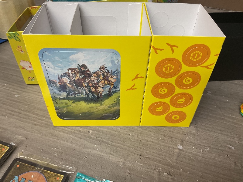 Photo 1 of Magic: The Gathering - Final Fantasy Chocobo Bundle (1 Chocobo Booster, 10 Play Boosters, 1 Alt-Art Promo Card, 1 Scene Card, 32 Basic Lands, 1 Click Wheel, and More)