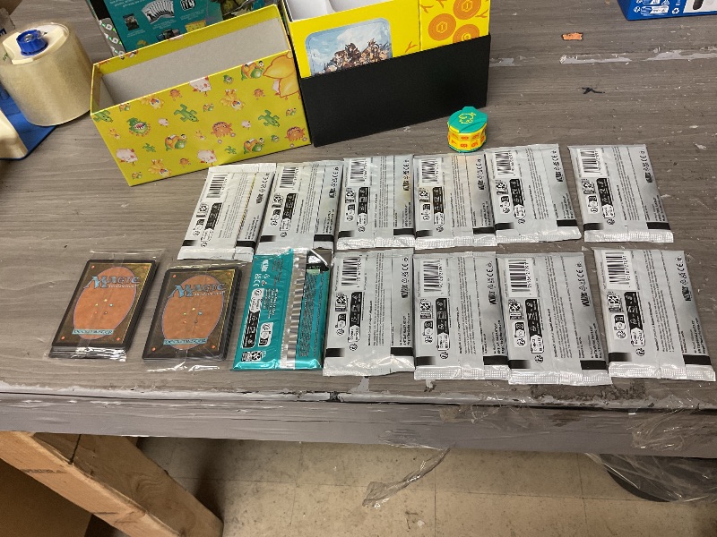 Photo 1 of Magic: The Gathering - Final Fantasy Chocobo Bundle (1 Chocobo Booster, 10 Play Boosters, 1 Alt-Art Promo Card, 1 Scene Card, 32 Basic Lands, 1 Click Wheel, and More)