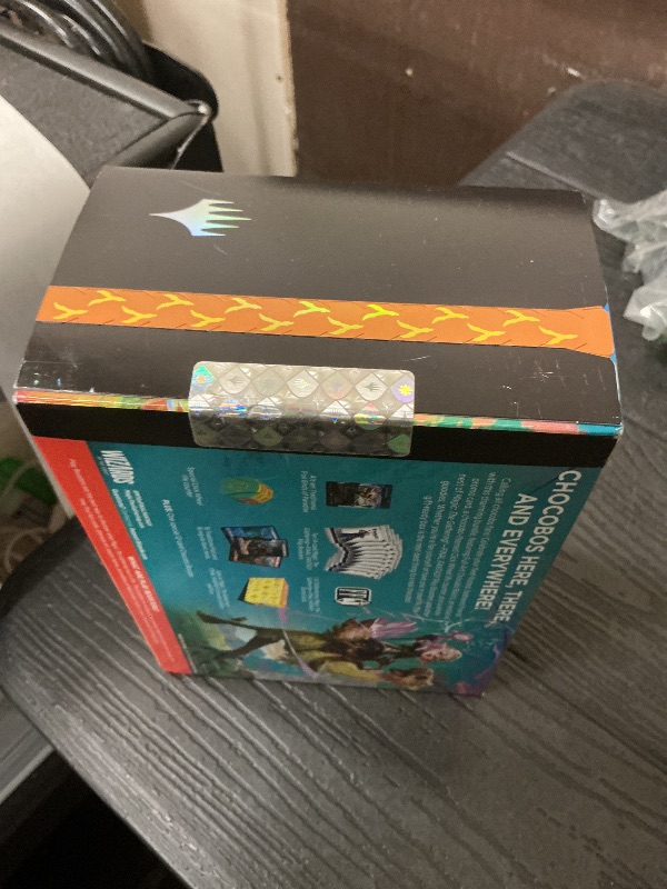 Photo 1 of Magic: The Gathering - Final Fantasy Chocobo Bundle (1 Chocobo Booster, 10 Play Boosters, 1 Alt-Art Promo Card, 1 Scene Card, 32 Basic Lands, 1 Click Wheel, and More)