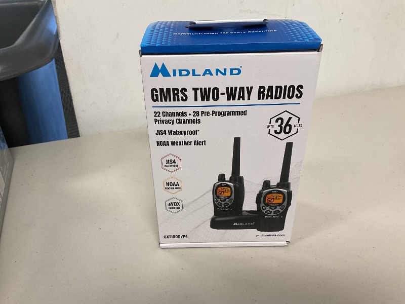 Photo 1 of Midland GXT1000VP4 GMRS Two-Way Radio (50-Channel, Long Range, 142 Privacy Codes, SOS, NOAA, Rechargeable Nickle Battery, Black/Silver, 2-Pack)