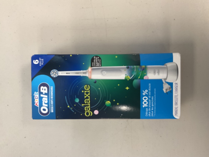 Photo 1 of Oral-B Kids Electric Toothbrush with Coaching Pressure Sensor and Timer, Rechargeable Toothbrush with Brush Heads, Galaxy
