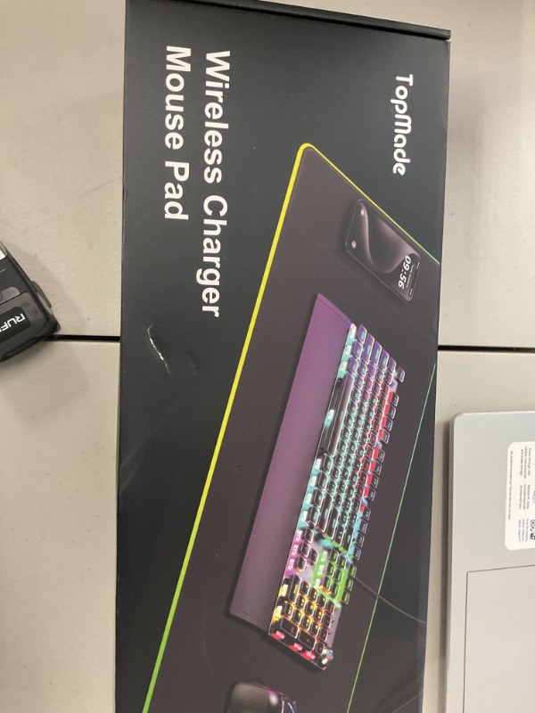 Photo 1 of TopMade RGB Gaming Mouse Pad, 15W Wireless Charging Mousepad with 13 Light Modes, Ultra-Smooth Surface, Non-Slip Base, Waterproof Keyboard Mat (Includes 20W PD Power Adapter & 6.56ft Woven Cable)