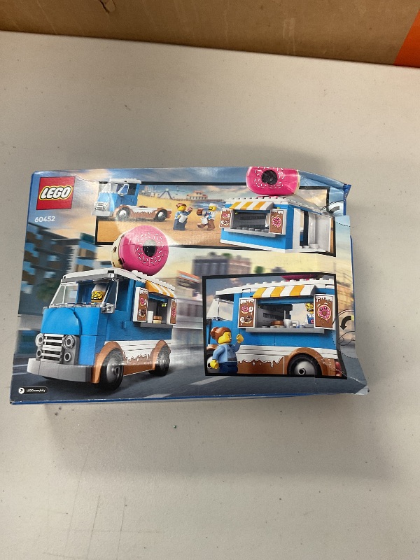 Photo 1 of LEGO City Donut Truck Toy - Building Toy for Kids, Boys and Girls, Ages 5+ - Birthday Gift for Kids Mobile Donut Stand with 2 Minifigures and Other Accessories - 60452
