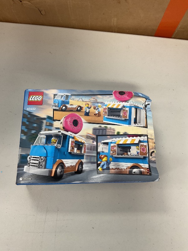 Photo 1 of LEGO City Donut Truck Toy - Building Toy for Kids, Boys and Girls, Ages 5+ - Birthday Gift for Kids Mobile Donut Stand with 2 Minifigures and Other Accessories - 60452