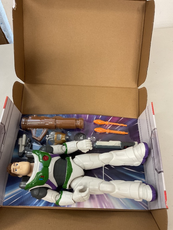 Photo 1 of Mattel Disney and Pixar Lightyear Toys, Buzz Lightyear Figure, Fully Equipped 12-in Action Figure with 4 Accessories, Collectible Gifts for Kids