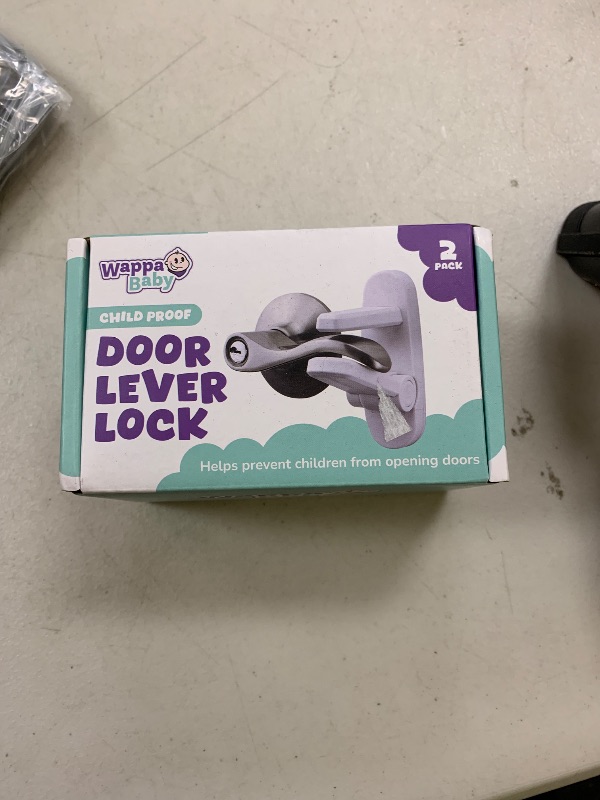 Photo 1 of Door Lever Lock (2 Pack) – Prevents Toddlers from Opening Doors – Easy One-Hand Operation for Adults – Durable ABS with 3M Adhesive Backing – No Tools Needed for Install