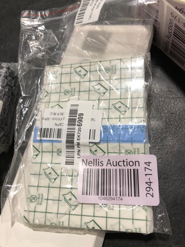 Photo 1 of 50 Pieces 4 x 6 in Stretch Waterproof Adhesive Bandages Transparent Film for Tattoo Aftercare and Skin Repair Adhesive Tattoo Supply Wrap
