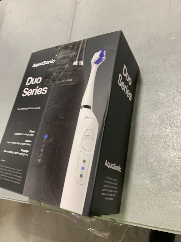 Photo 1 of Aquasonic Duo - Dual Handle Ultra Whitening 40,000 VPM Wireless Charging Electric ToothBrushes - 3 Modes with Smart Timers - 10 Dupont Brush Heads & 2 Travel Cases Included