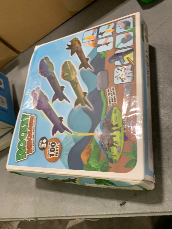 Photo 1 of Gizzjoy Dinosaur Toy Rocket Launcher for Kids - Launch Up to 100 Ft, 4 Rockets, Outdoor Outside Toys for Kids, Dinosaur Toys, Birthday Gifts for 3 4 5 6 7 8-12 Year Old Boys Girls
