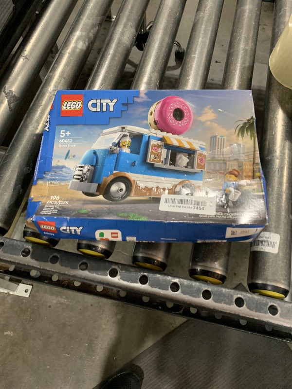 Photo 1 of LEGO City Donut Truck Toy - Building Toy for Kids, Boys and Girls, Ages 5+ - Birthday Gift for Kids Mobile Donut Stand with 2 Minifigures and Other Accessories - 60452