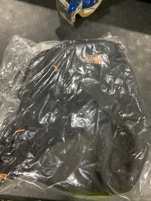 Photo 1 of THE NORTH FACE Women's Isabella Sling | Slim Carry Crossbody Bag with Large Main Compartment, Water-Repellent Finish, TNF Black Light Heather/Burnt Coral Metallic-NPF, One Size