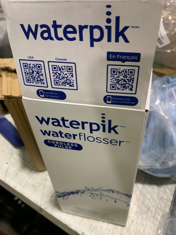 Photo 1 of Waterpik Cordless Pulse Rechargeable Portable Water Flosser for Teeth, Gums, Braces Care and Travel with 2 Flossing Tips, Waterproof, ADA Accepted, WF-20 White, Packaging May Vary