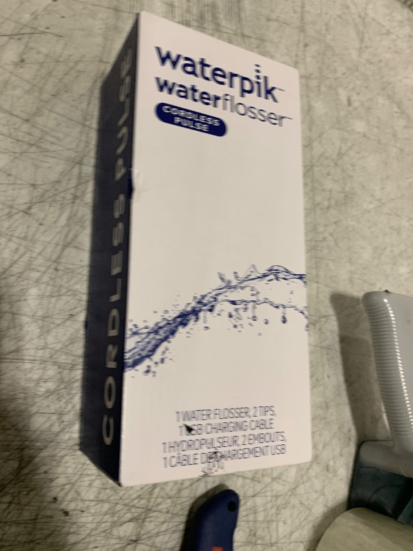 Photo 1 of Waterpik Cordless Pulse Rechargeable Portable Water Flosser for Teeth, Gums, Braces Care and Travel with 2 Flossing Tips, Waterproof, ADA Accepted, WF-20 Blue, Packaging May Vary