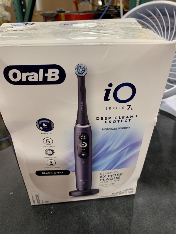 Photo 1 of Oral-B iO Deep Clean + Protect Rechargeable Electric Toothbrush, Black with a iO Series 7 Toothbrush, 2 Replacement Brush Heads, and a Charging Travel Case