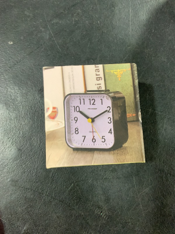 Photo 1 of Peakeep Small Battery Operated Analog Travel Alarm Clock Silent No Ticking, Lighted on Demand and Snooze, Beep Sounds, Gentle Wake, Ascending Alarm, Easy Set (Black)