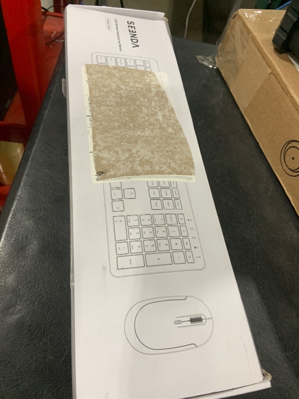 Photo 1 of Wireless Keyboard and Mouse Combo - Full Size Slim Thin Wireless Keyboard Mouse with Numeric Keypad 2.4G Stable Connection Adjustable DPI (White & Silver)