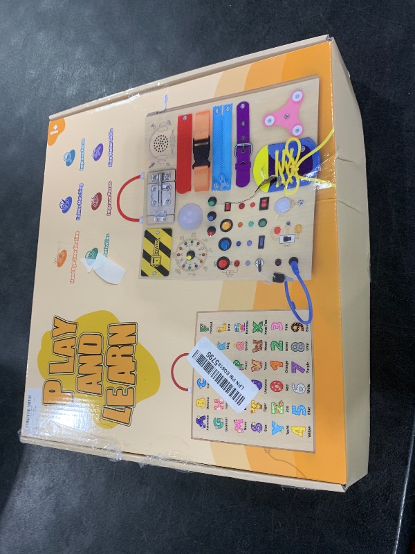 Photo 1 of 23 in 1 Busy Board Montessori Toys for 1-3 Year Old Wooden Learning Educational Toy for Toddlers with 15 Switches, 26 LED Lights, Music Boxes, Locks,Zippers Toddler Sensory Toys for Soothing A Baby