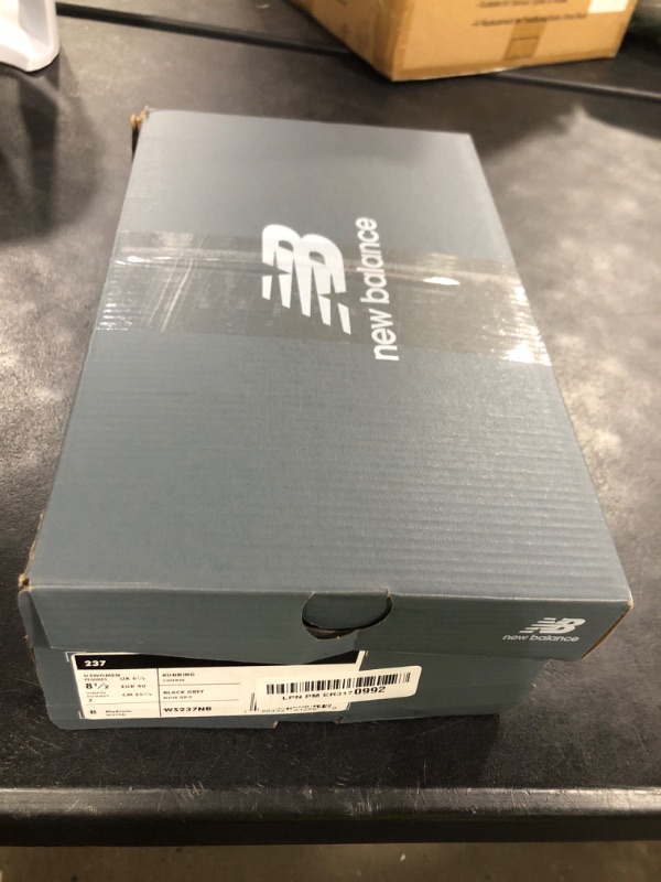 Photo 1 of New Balance Women's 237 V1 Classic Sneaker, Black/Magnet/Sea Salt, 8.5