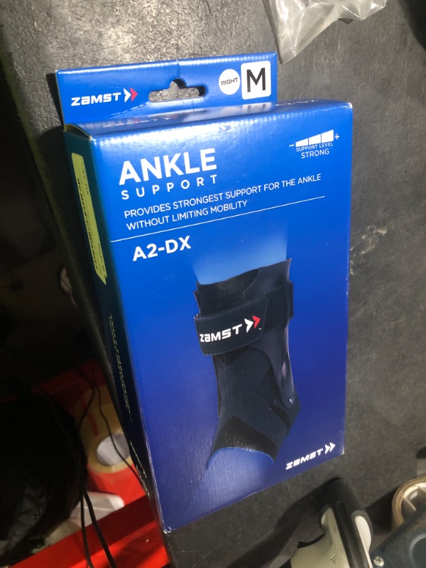 Photo 1 of Zamst A2-DX Sports Ankle Brace with Protective Guards For High Ankle Sprains and Chronic Ankle Instability-for Basketball, Volleyball, Lacrosse, Football-Black, Right, Medium