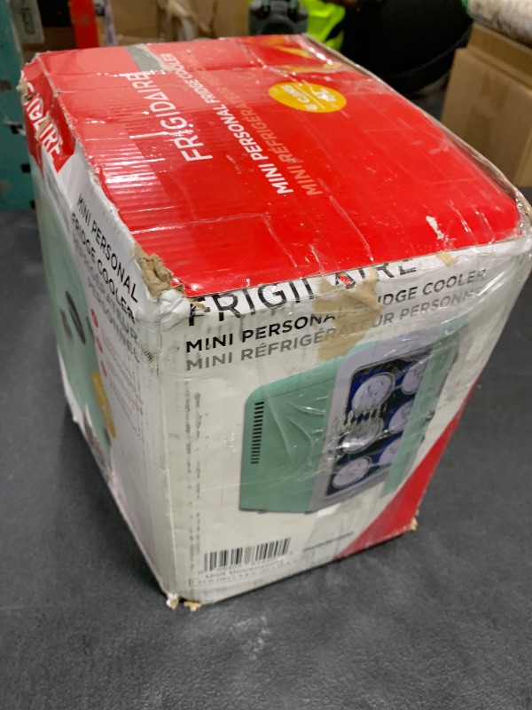 Photo 1 of Frigidaire EFMIS129-MINT Mini Personal Fridge Cooler, 1 Gal Capacity fits Six Cans, Includes Plugs for Home Outlet & DC Charger-9.84" D x 7.09" W x 10.35" H