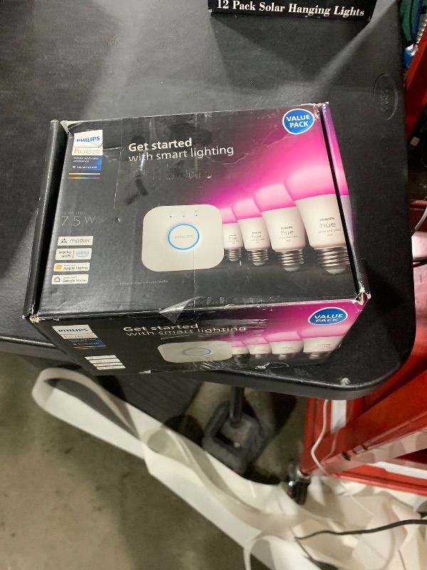Photo 1 of Philips Hue Smart Light Starter Kit - Includes (1) Bridge and (4) 75W A19 E26 LED Smart White and Color Ambiance Bulbs - Control with App - Compatible with Alexa, Google Assistant, and Apple HomeKit