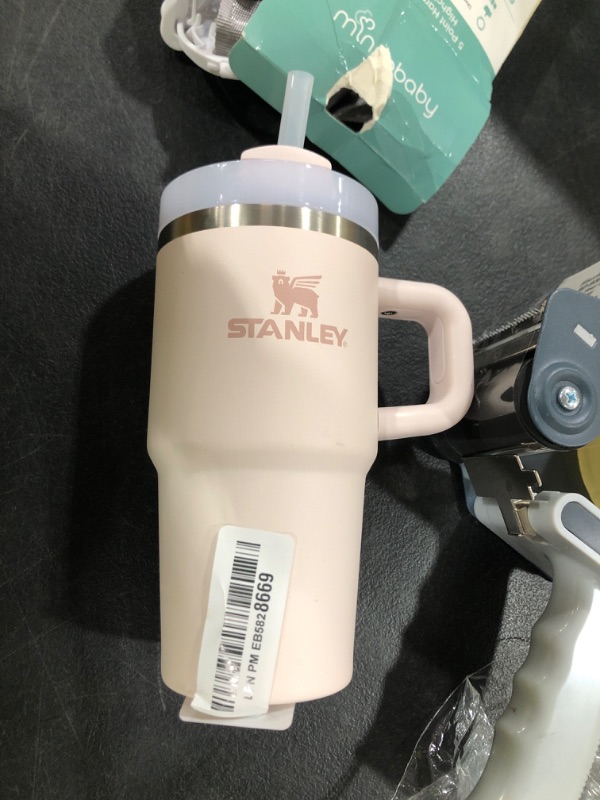 Photo 1 of STANLEY Quencher H2.0 Tumbler with Handle and Straw 20 oz | Flowstate 3-Position Lid | Cup Holder Compatible for Travel | Insulated Stainless Steel Cup | BPA-Free | Rose Quartz 2.0