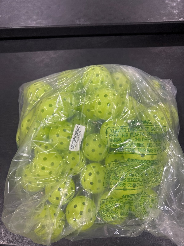 Photo 1 of multi count pickleballs 