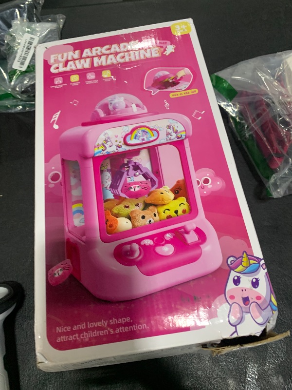 Photo 1 of TingingYuli Claw Machine for Kids,Unicorn Mini Vending Machines Candy Grabber Prize Dispenser Toys for Girls,Electronic Arcade Game with 20 Mini Plush Toys for Christmas Easter Birthday Gifts
