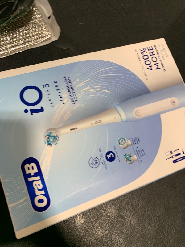 Photo 1 of Oral-B iO Series 3 Limited Rechargeable Electric Powered Toothbrush, Blue with 2 Brush Heads and Travel Case - Visible Pressure Sensor to Protect Gums - 3 Modes - 2 Minute Timer