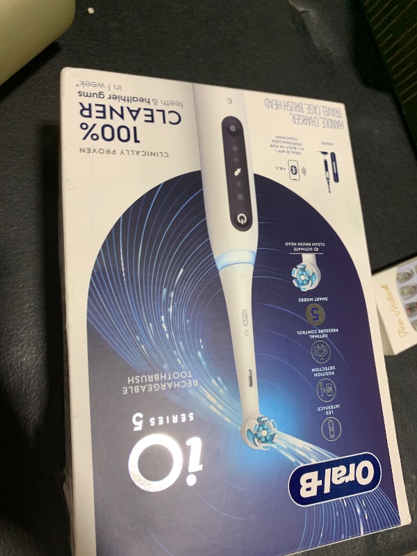 Photo 1 of Oral-B iO Series 5 Rechargeable Electric Toothbrush with Visible Pressure Sensor to Protect Gums, 2 Minute Timer, 5 Cleaning Settings, 1 Replacement Toothbrush Heads, and Travel Case, White