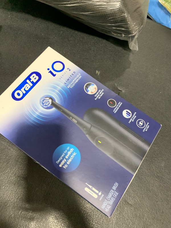 Photo 1 of Oral-B iO Simple Clean Rechargeable Electric Powered Toothbrush, Night Black with 1 Gentle Care Brush Head and 1 Black Travel Case - Automatic Pressure Sensor to Protect Gums - 3 Modes - 2 Min Timer