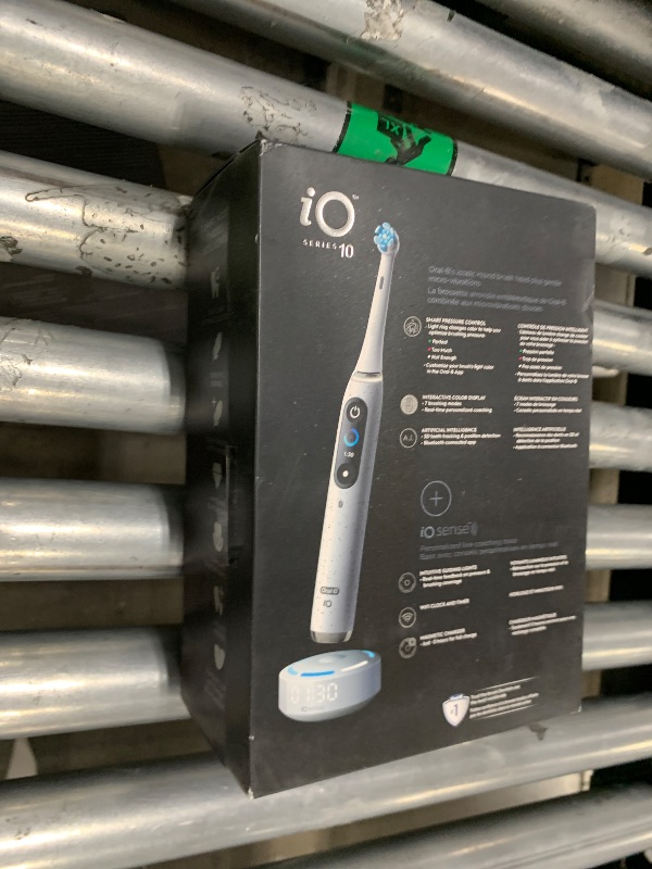 Photo 1 of Oral-B iO Series 10 Rechargeable Electric Toothbrush with Visible Pressure Sensor to Protect Gums, 2 Min Timer, 7 Cleaning Settings, 4 Replacement Toothbrush Heads, and Charging Travel Case, White