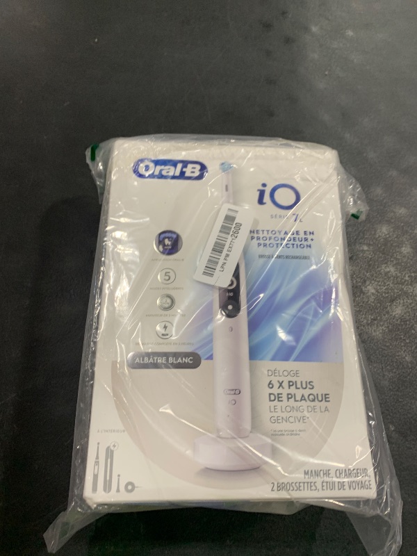 Photo 1 of Oral-B iO Deep Clean + Protect Rechargeable Electric Toothbrush, White with a iO Series 7 Toothbrush, 2 Replacement Brush Heads, and a Charging Travel Case