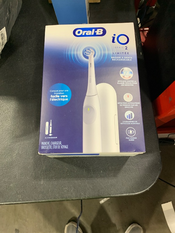 Photo 1 of Oral-B iO Simple Clean Rechargeable Electric Powered Toothbrush, Pure White with 1 Gentle Care Brush Head and 1 White Travel Case - Automatic Pressure Sensor to Protect Gums - 3 Modes -2 Min Timer