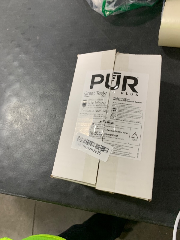 Photo 1 of PUR PLUS Vertical Faucet Mount Water Filtration System, Lead-Reducing Filter, Great-Tasting Water, Easy Install, Lasts 100 Gallons, Compatible with Sinks with External Aerators, Grey
