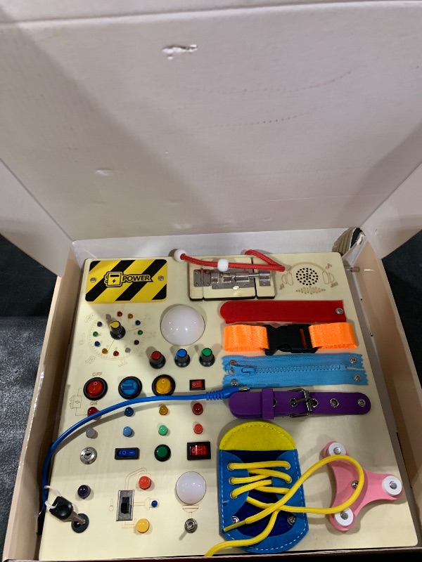 Photo 1 of 23 in 1 Busy Board Montessori Toys for 1-3 Year Old Wooden Learning Educational Toy for Toddlers with 15 Switches, 26 LED Lights, Music Boxes, Locks,Zippers Toddler Sensory Toys for Soothing A Baby