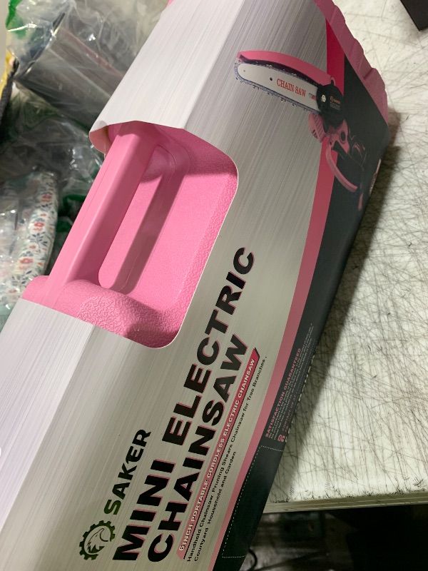Photo 1 of Saker Mini Electric Chainsaw,6 Inch, Handheld Portable Chain Saw Pruning Shears Chainsaw Cordless for Tree Branches,Household and Garden(SAKER MINI CHAINSAW PINK + 2 BATTERIES + 3 CHAINS)