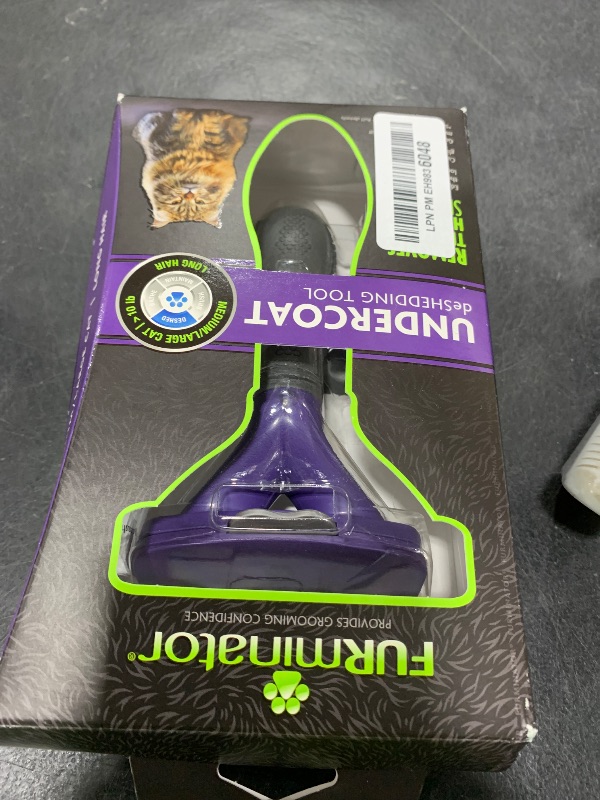 Photo 1 of FURminator® deShedding Tool For Medium/Large Cats, Long Hair, Removes Loose Hair From Shedding
