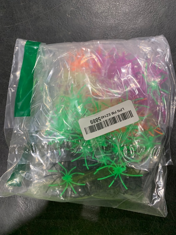 Photo 1 of 150PCS Plastic Spiders Halloween Small Plastic Spiders Fake Spiders Realistic Spider Toys Prank Props for Home and Party Decor, 2 x 1.8 Inches, Black, Green, Orange, Purple, Glow in The Dark Spiders