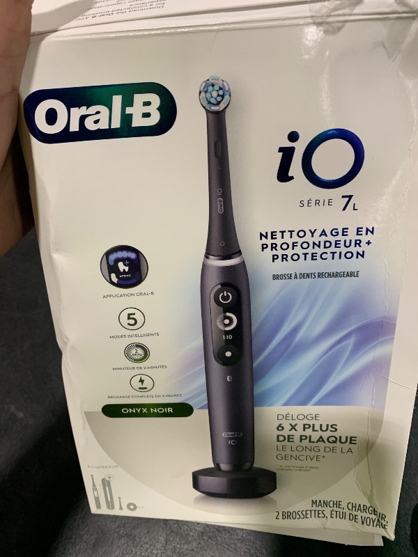 Photo 1 of Oral-B iO Deep Clean + Protect Rechargeable Electric Toothbrush, Black with a iO Series 7 Toothbrush, 2 Replacement Brush Heads, and a Charging Travel Case