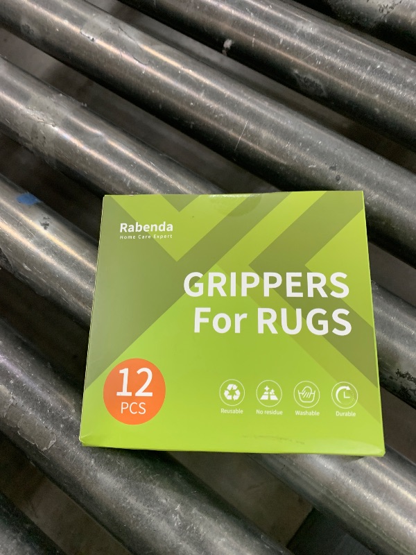 Photo 1 of Rabenda 12 Pcs Rug Tape, Non Slip Rug Pads Grippers for Hardwood Floors and Tiles, Reusable Carpet Tape for Area Rugs, Double-Sided Adhesive Rug Stickers Keep Corners Flat (Black)