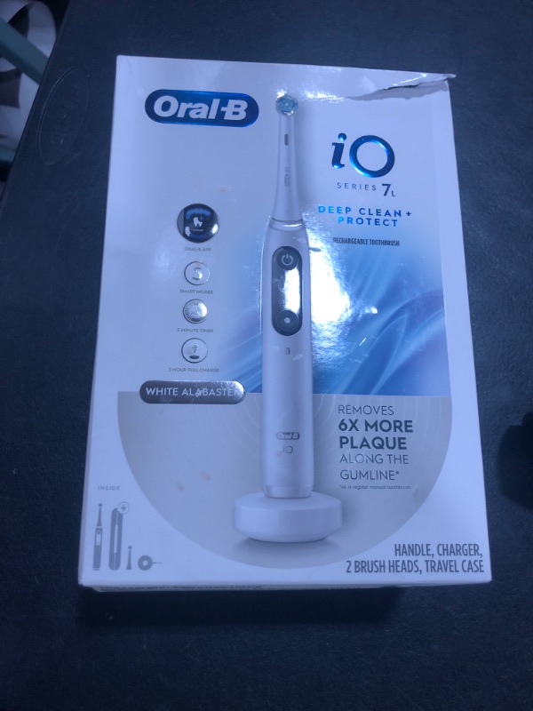 Photo 1 of Oral-B iO Deep Clean + Protect Rechargeable Electric Toothbrush, White with a iO Series 7 Toothbrush, 2 Replacement Brush Heads, and a Charging Travel Case